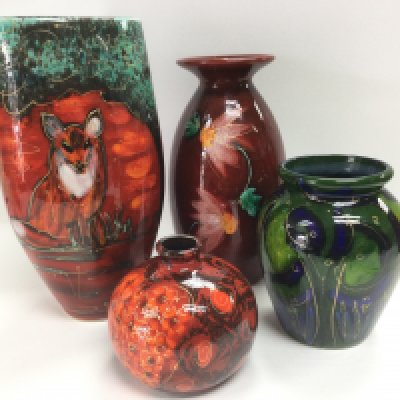 Four Anita Harris pottery vases comprising signed examples including a tall vase with fox, approx 24cm, a Marrakesh vase, Daisy chain and Ali Baba. Shipping category D.