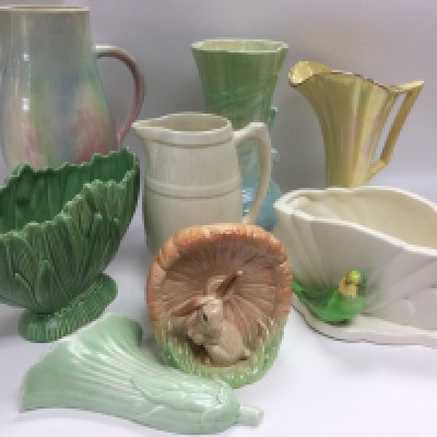 A collection of Art Deco and vintage vases and wall pockets comprising Sylvac and Beswick examples. Shipping category D.