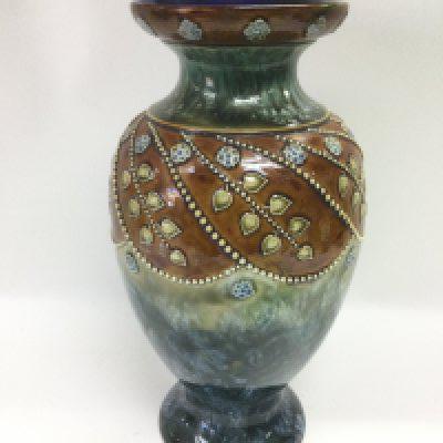 A Doulton Lambeth vase in browns, greens and blues, approx height 28.5cm. Shipping category D.