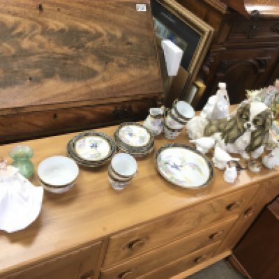 A large collection of mixed ceramics items including part tea set royal Doulton figurines a resin dog etc. NO RESERVE