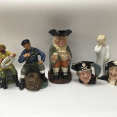 Six Royal Doulton caricature jugs and figures.