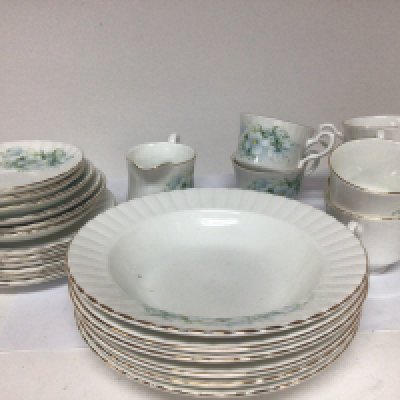 A royal Stafford bone china tea set decorated with flowers on a white glazed ground six place setting with a set of soup bowls no obvious damage. NO RESERVE