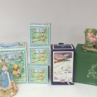 A Beswick Mad Hatter porcelain figure group Royal Doulton 101 Dalmatian and Royal Doulton Winnie the Pooh collection and two Beswick Doulton Peter Rabbit large size figures in one box.-
