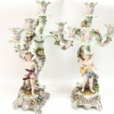 A pair of Continental candelabras, some damage and restoration. this lot cannot be posted