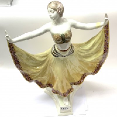 Albert Dominique Rose 'Figure of a dancer', model no.4141, circa 1915 Glazed polychrome earthenware. 54.5cm high Manufactured by Goldscheider, Vienna, Austria. Signed 'Rosa' in the mould, printed factory back stamp and painted marks N/XXVII. (Small chip to front plinth). (D, in house Postage is not offered on this lot.)