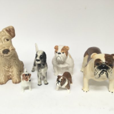 A Collection of Beswick and Doulton Bull dog and Jack Russell figures and other dog figures.