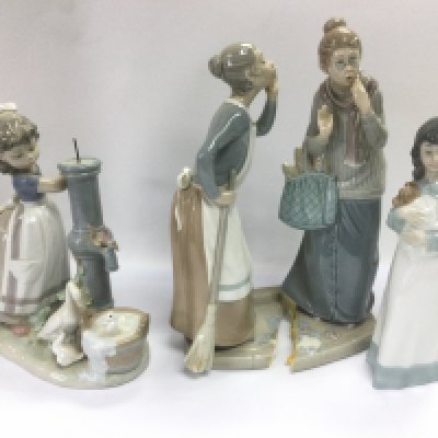 Two boxed Lladro figures and a boxed Nao figure, some damages. Shipping category D.