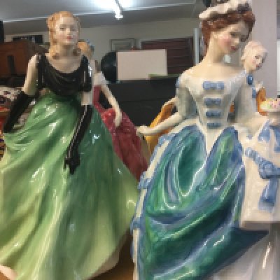 A collection of four Royal Doulton figures