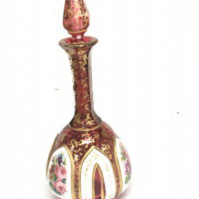 A Quality Victorian overlay ruby glass scent bottle with applied gilt and raised opaque panels with hand painted sprays of flowers. Height 20cm no obvious damage good condition.