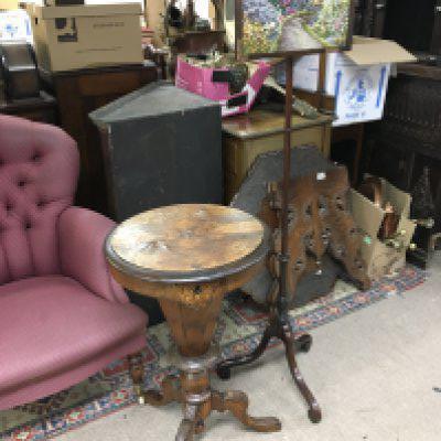 An inlaid and carved design walnut workbox table (78cm tall) and an embroidery panel on a stand