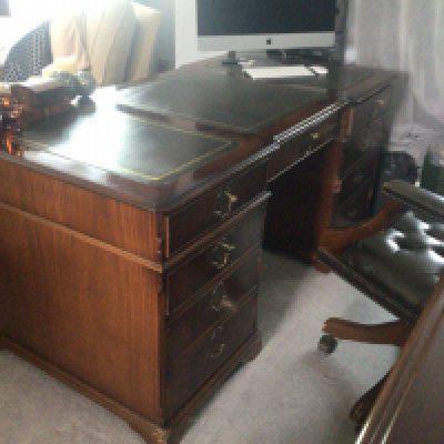 A Large Mahogany office desk with a green leather top with a matching green leather button back office chair. Sold in situ buyer to collect viewing by appointment only.