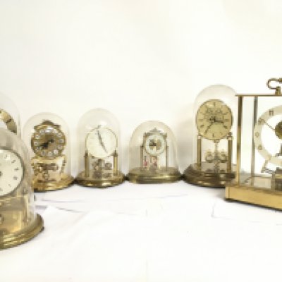 A collection of vintage brass domed clocks. This lot cannot be posted
