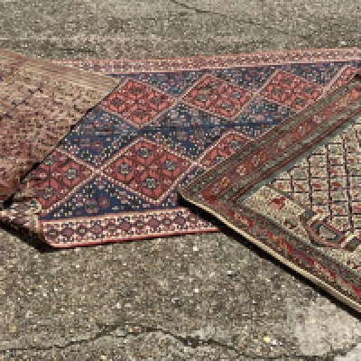 A Hank knotted Kilimanjaro rug ( condition issues) together with 2 additional smaller rugs.149 x 108cm / 220cm x 137cm / 110cm x 110cm
