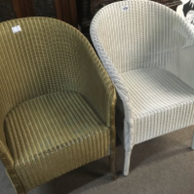 Two Lloyd Loom chairs .
