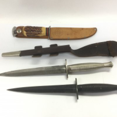 Three daggers including a Wilkinson Sword example. Shipping category D.
