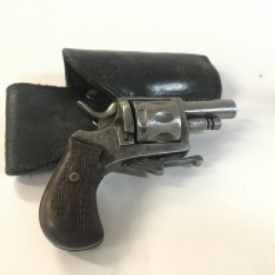 An obsolete calibre fritum mkvIII pistol with leather holster.