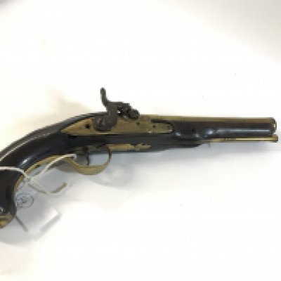 A brass bored percussion pistol.