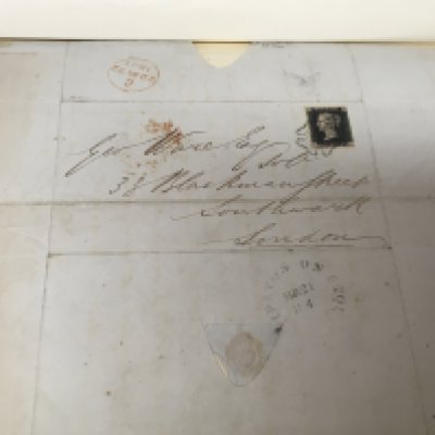 The red Grafton album of stamps a collection of Victorian stamps including a penny black on an envelope with Mail stamp mark for 1841other later stamps to Elizabeth II mainly all used stamps.