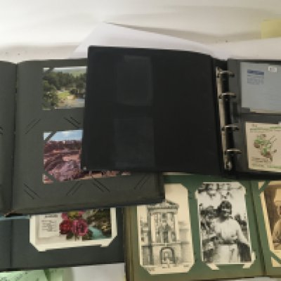 A Collection of postcards and early postal covers in albums. NO RESERVE