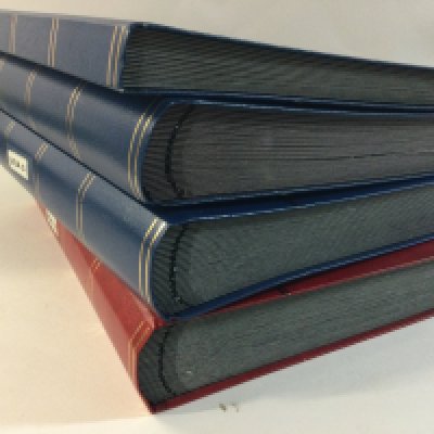 A box containing a mixed selection of U.S stamps in albums and loose.