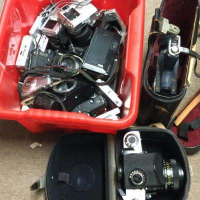 A collection of vintage cameras including Kneb-60, Chinon, Pentax and various modern digital cameras
