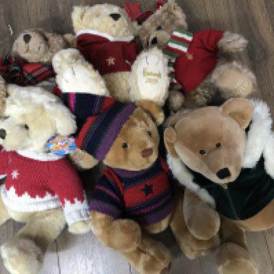 A collection of Harrods Christmas bears, in various Christmas clothing, with ear labels