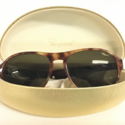 A cased pair of Chopard SCH 134 sunglasses. Postage category A