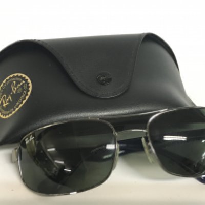 A pair of cased Ray Ban RB3445 sunglasses. Postage category A