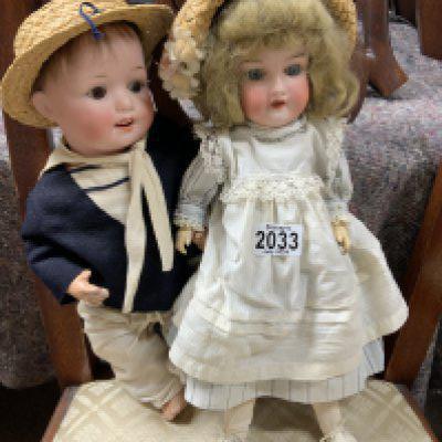 A vintage Armand Marseille porcelain doll stamped 390 / 2. Together with a boy Heubach doll 300.1. Kopplesdorf. (D)- NO RESERVE