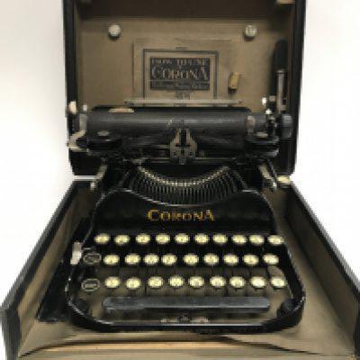 A corona typewriter and a set of gold weighing scaled with weights.- NO RESERVE