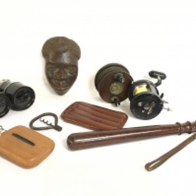 A Truncheon, vintage fishing reels including a Silstar TL35, pair of vintage black leather binoculars, wooden carved African head and a hip flask. This lot cannot be posted