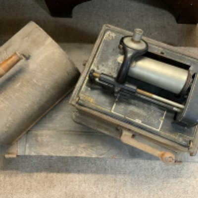 A vintage Edison phonograph together with a case of phonograph reels. (D) in need if attention.