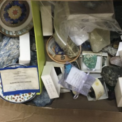 A box containing samples of uncut Mineral rock crystal and stone samples and other ornaments