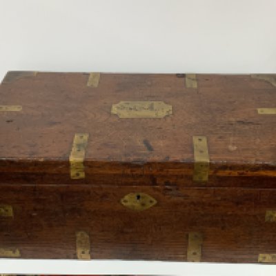 A large brass bound chest with engraved panel, An oriental camphor wood jewel casket, Victorian walnut brass bound letter box. (D)
