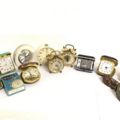 A collection of travel clocks including Europa, Estyma, Kiezle, Econ. This lot cannot be posted