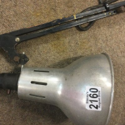 A angle lamp with chrome shade .