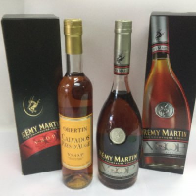 Three bottles of Remy Martin cognac and a bottle of Calvados (4). Shipping category D