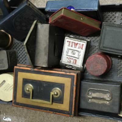 A collection of vintage money boxes including a US MAIL box, brass bear box, trench art money box, book money boxes. postage category C