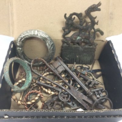 A box of antiquarian items including some bronze examples. Shipping category B.