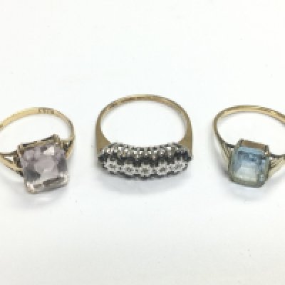 Three 9ct gold rings set with stones, approx 5.5g. Shipping category A.