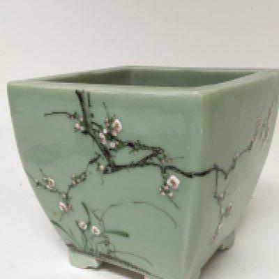 A Chinese early 20th century Celadon jardiniere with sprig decoration no damage or restoration Hight 19cm. Diameter 20cm.