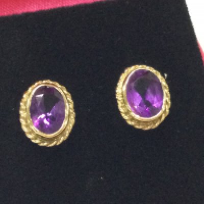 A pair of 9ct amethyst earrings. Postage B