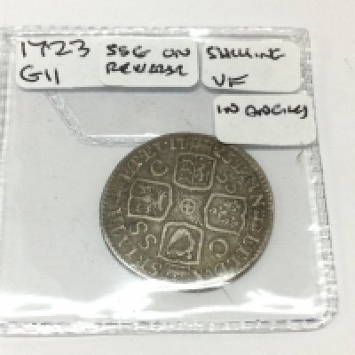 A 1723 GII shilling. Postage A
