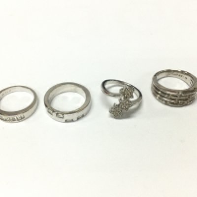 Four 9ct white gold diamond rings of various designs. 24.33g total. Sized M 1/2 to N Postage B