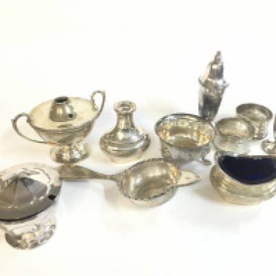 A Collection of cruets, napkin rings , sugar sifter etc. postage category B