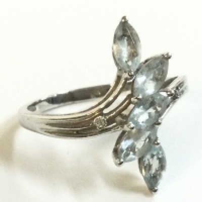 A 9ct white gold ring topaz ring, size R, 2.6g total weight. postage category A
