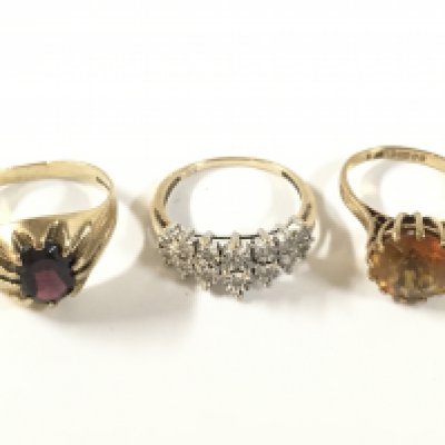 Three 9ct gold stone set rings. Approx weight 8.62 grams.