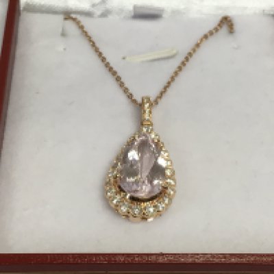 An 18ct rose gold pear shaped morganite and RBC diamond pendant on a rose gold plated chain. Morganite approx 3.88ct, diamonds approx 0.65ct. Approx 4.7g. Shipping category A.