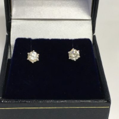A pair of 18ct white gold six claw set RBC diamond solitaire studs. Diamonds approx 0.75ct. Shipping category A. Approx 1.3g. Shipping category A.