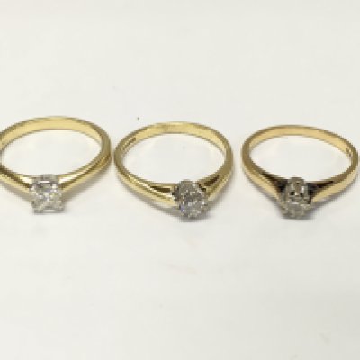 Three 18ct gold diamond solitaire rings. Sizes L and N approximately 8.4g